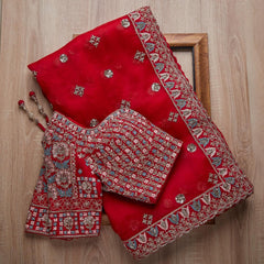Adorning Red Rangoli Silk Saree With Designer Fancy Readymade Blouse.